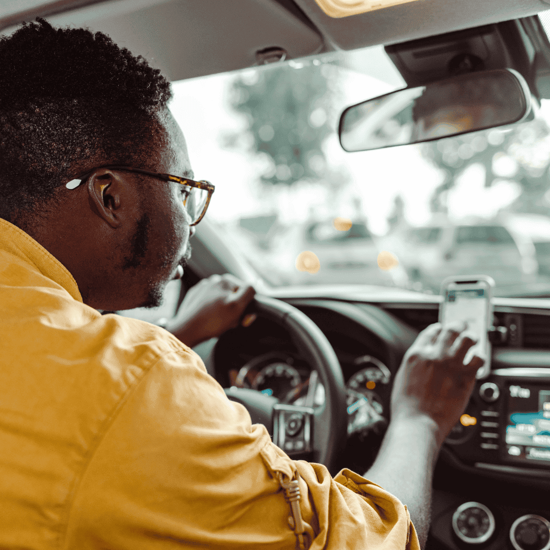 An Uber driver typing in the location on his GPS