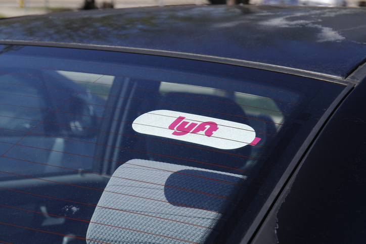 Car for hire with a Lyft sticker. Lyft and Uber have replaced many Taxi cabs for transportation with a smart phone app I